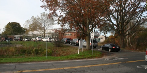 This figure is an image showing an improved section of Summer Street and shows an auto, a truck, a bicycle, and a parent and student walking.